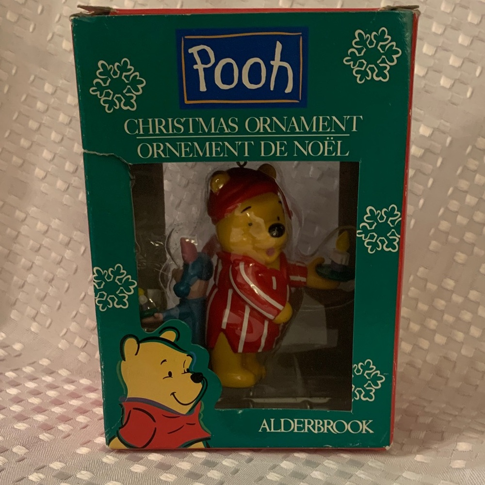 Winnie the Pooh holiday ornament; Pooh and Piglet in nightgowns holding candles.